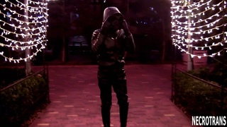 Night and shine of a leather suit. Black leather down jacket, leather leggings and respirator