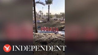 Israeli tank drives over ’I love Gaza’ sign as military takes control of Rafah crossing