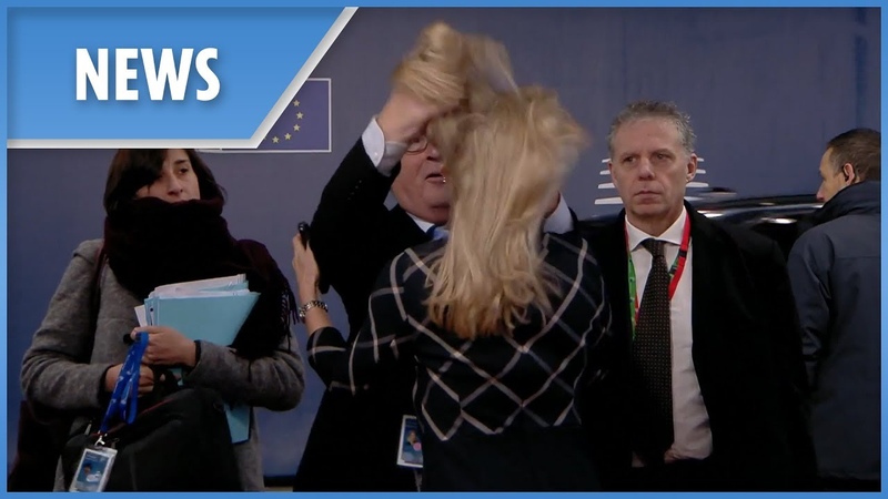 Bizarre moment Juncker ruffles womans